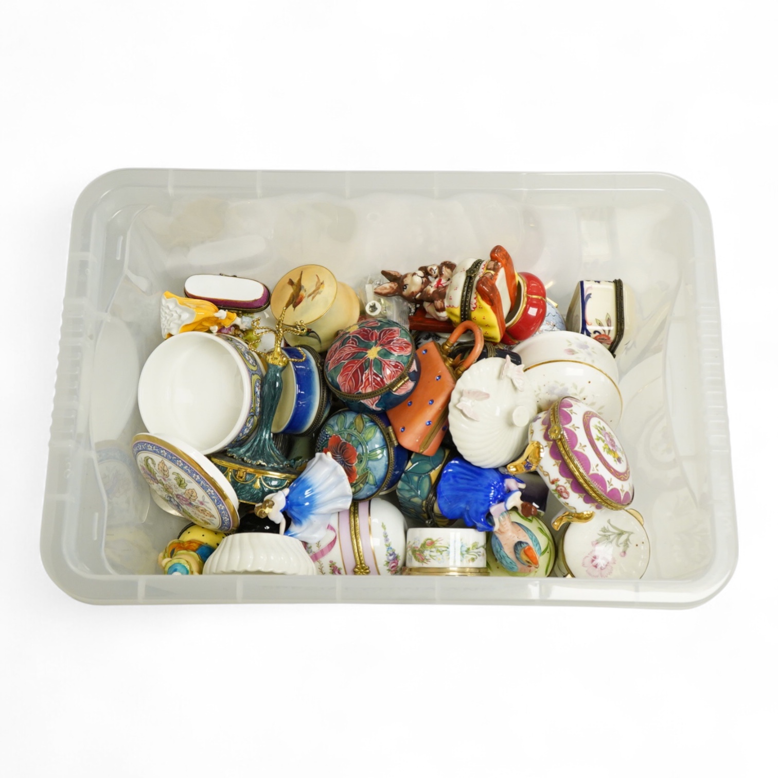A collection of various shaped china pill boxes, Limoges, Aynsley etc